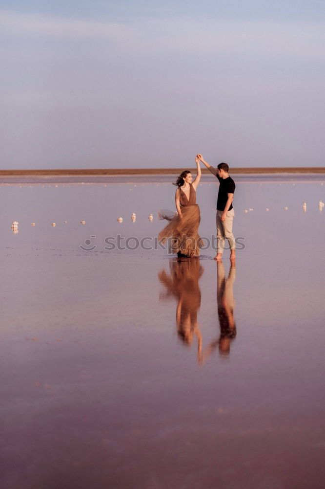 Similar – Silhouetten von drei Reitern bei Sonnenschein am Strand