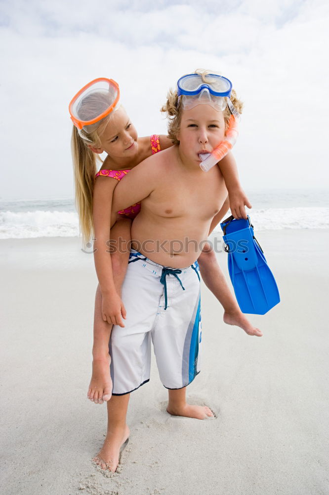 Similar – Image, Stock Photo caucasian mother and son playing with windmill at the beach