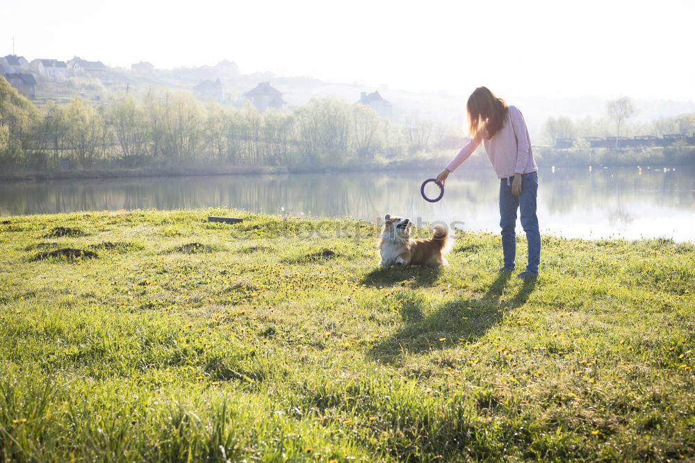 Similar – Image, Stock Photo Young woman with small dog at the lake