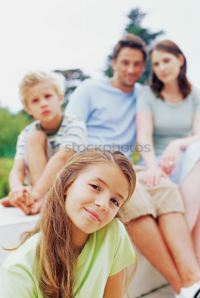 Similar – Family spending vacation time together having a snack sitting on jetty over the lake on sunny day in the summertime