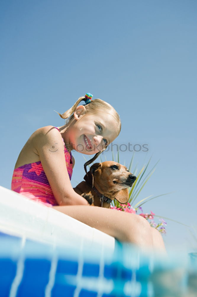 Similar – Two funny kids  in the pool on an air mattress