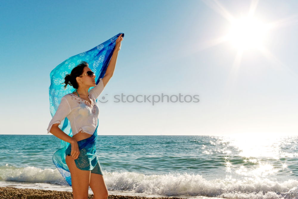 Similar – A young woman sitting under a surfboard