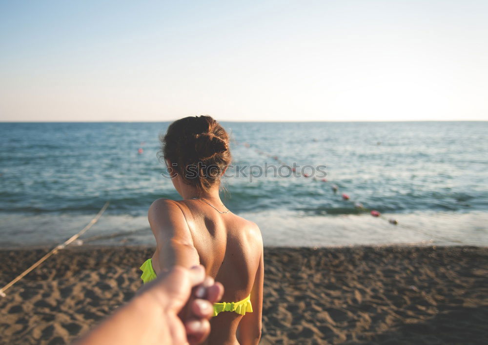 Similar – Image, Stock Photo Young naked woman holding man hand on shore near water