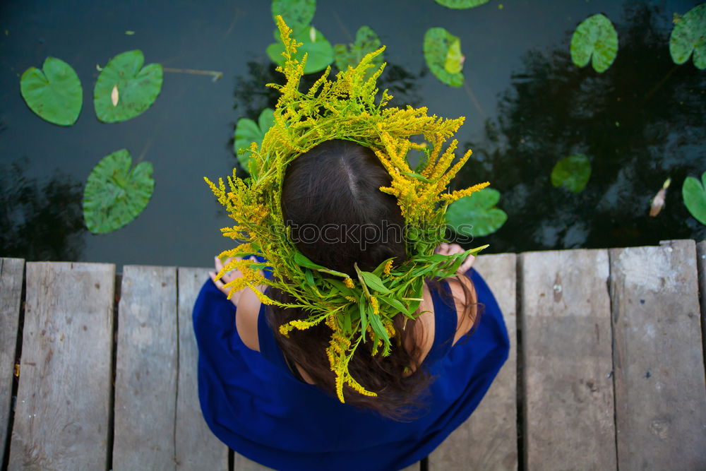 Similar – Image, Stock Photo Woman touching yellow flower