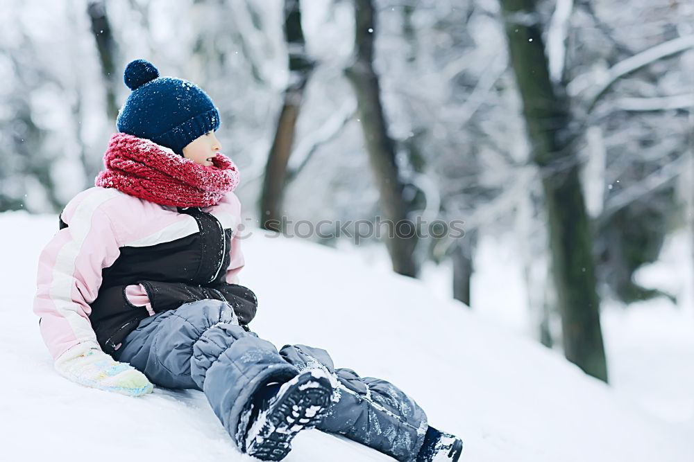 Similar – Image, Stock Photo Little girl enjoying winter walking through deep snow. Toddler is playing outdoors while snow falling. Child is wearing dark blue snowsuit and wool cap