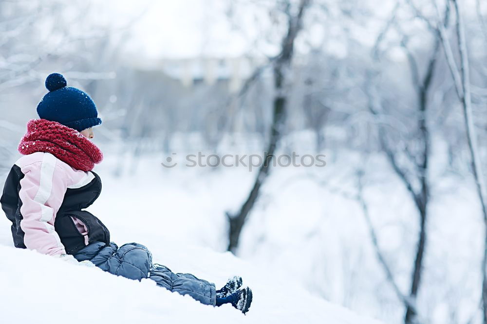 Similar – Image, Stock Photo Little girl enjoying winter walking through deep snow. Toddler is playing outdoors while snow falling. Child is wearing dark blue snowsuit and wool cap