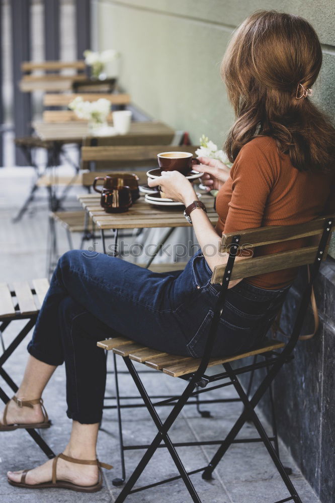 Similar – Attractive teenager sitting on steps in town