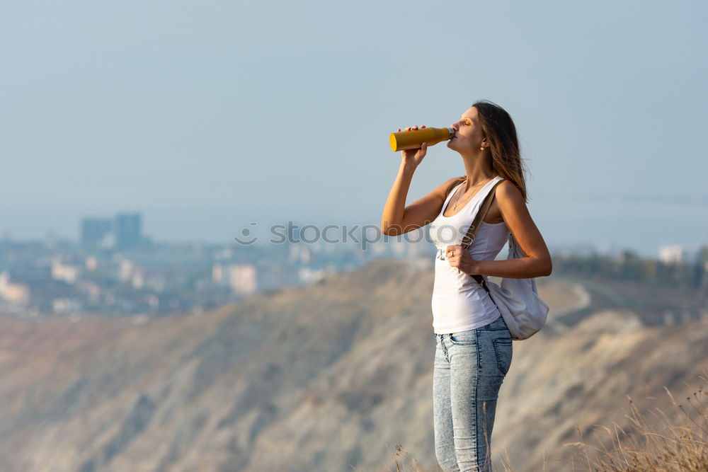 Similar – Image, Stock Photo Blonde girl drinking water during morning jogging