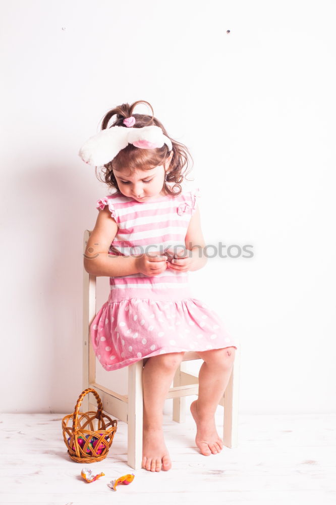 Little girl wearing rabbit ears