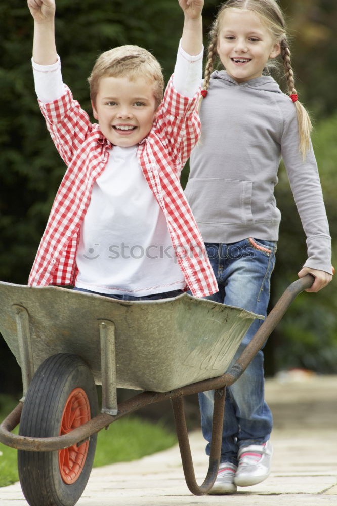 Similar – Image, Stock Photo Young boy pushing little sister in a baby stroller