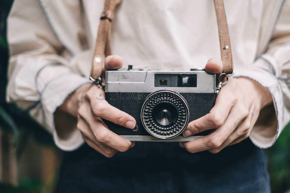 Similar – Photographer aiming with vintage camera