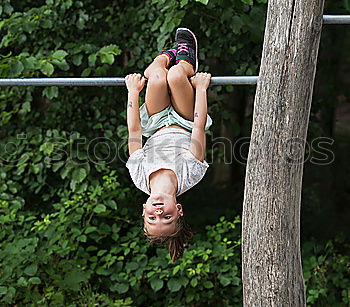 Similar – Child bouncing on a trampoline