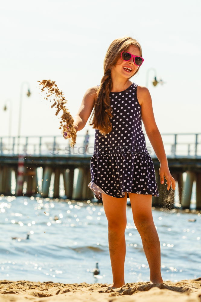 Similar – Image, Stock Photo Young girl sitting on jetty over the lake and dipping feet in water on sunny day in the summertime