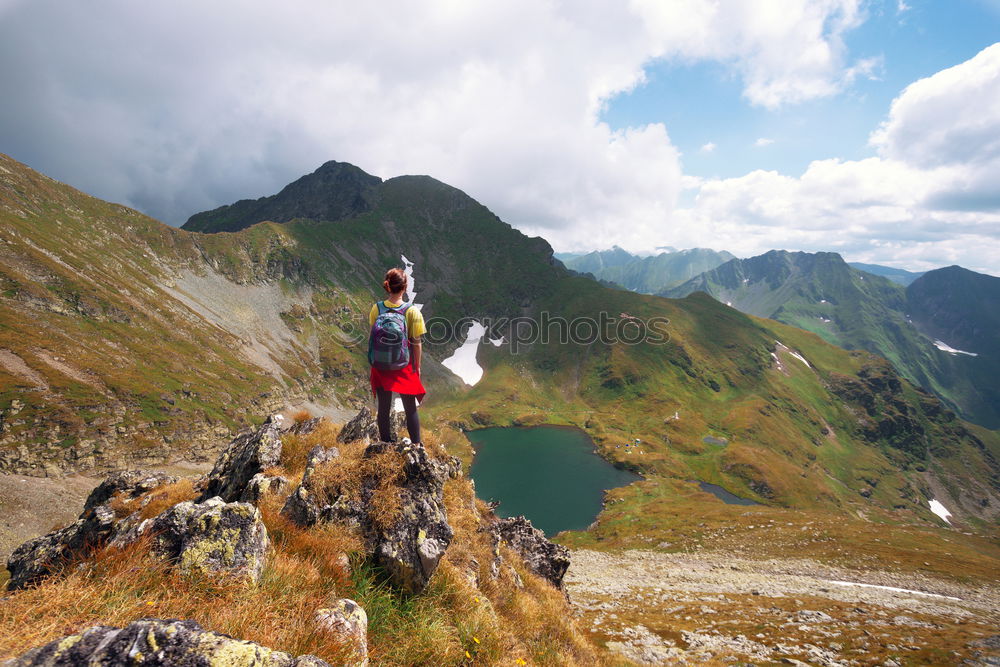 Similar – Hikers with rucksack in the mountains