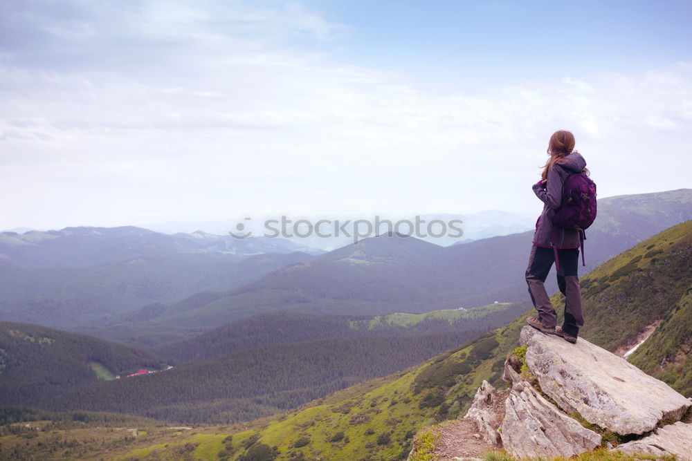 Similar – Woman walks on a mountain path in a sunny day.