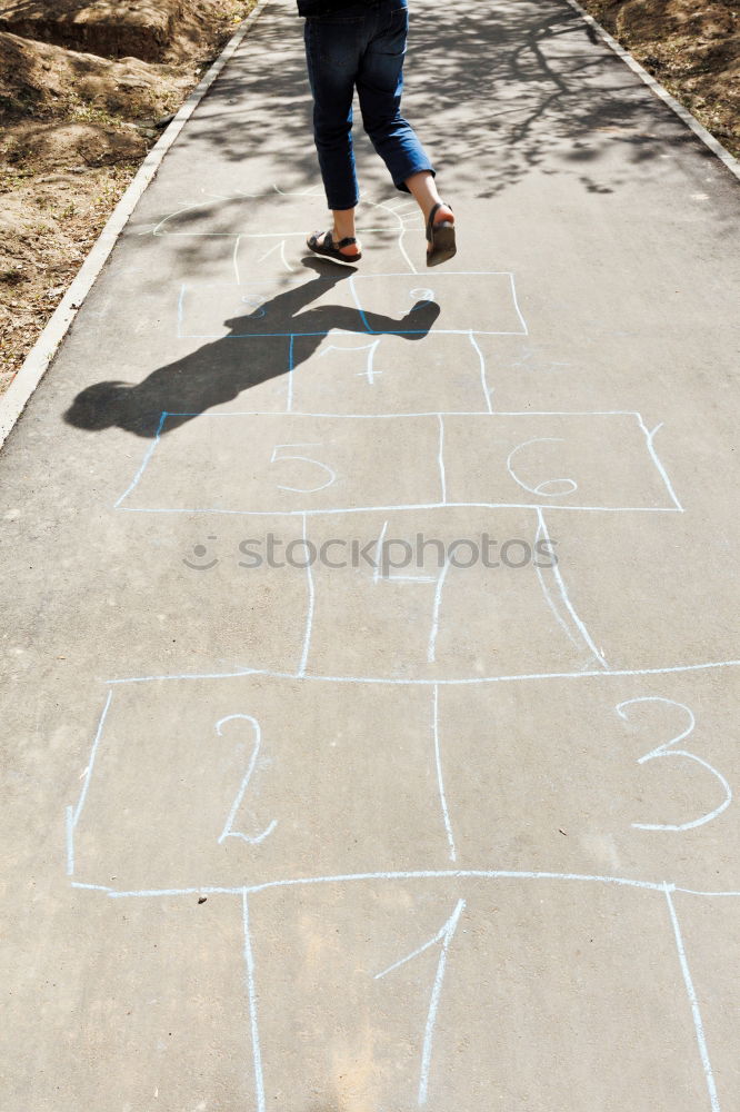 Similar – Crop man riding skateboard in desert