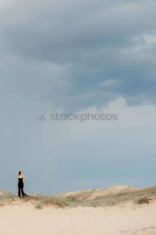 Similar – Young man walking away on beach