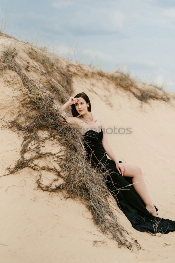 Similar – Image, Stock Photo young woman with turquoise hair sits barefoot leaning against tree in beach forest and looks at camera