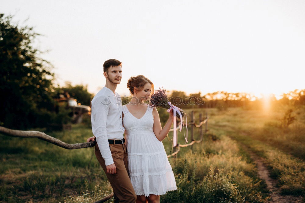 Similar – Image, Stock Photo Young adult adventerous couple hitchhiking together