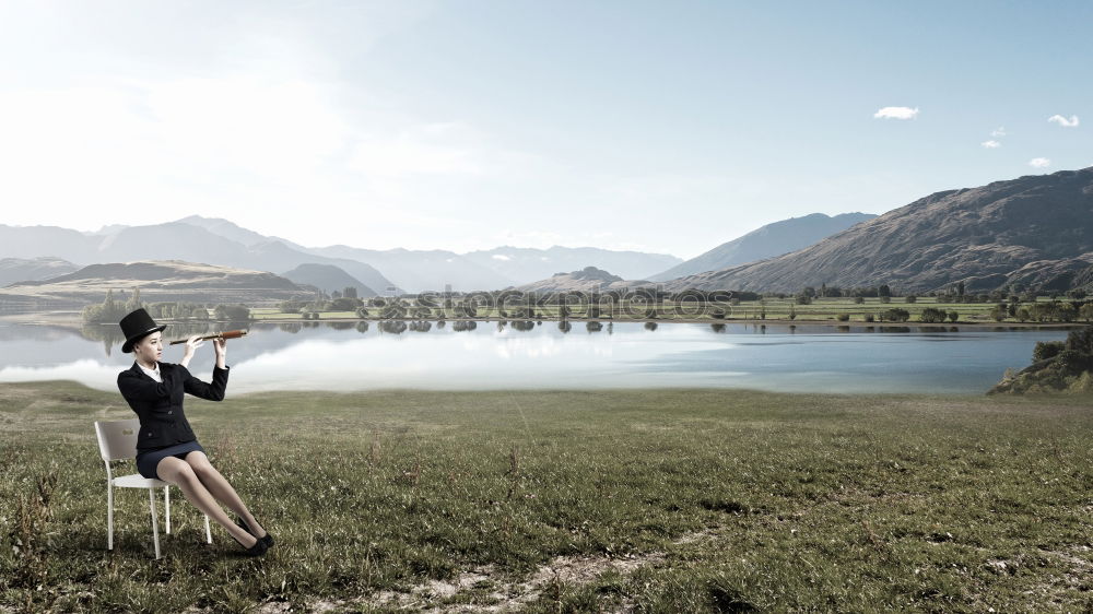 Similar – Women at lake in mountains