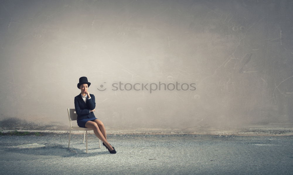 Similar – Woman with umbrella in front of green wall