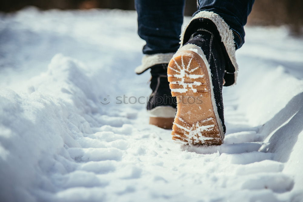 Similar – portrait woman boots on a road with snow in winter walking