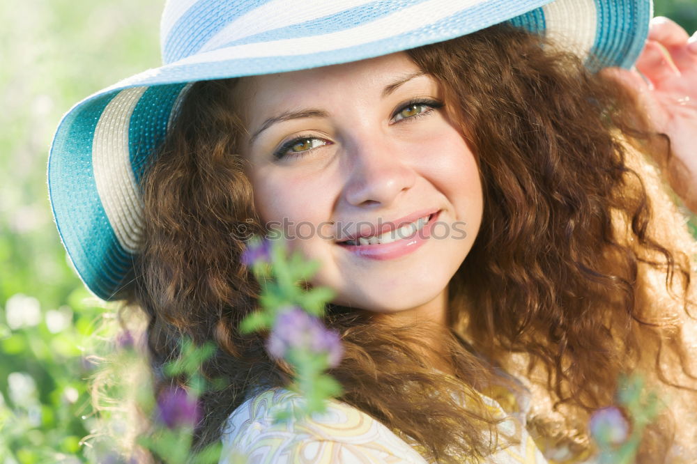 Similar – romantic portrait of happy child girl picking bouquet of beautiful blue delphinium flowers from summer garden