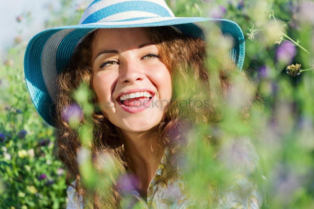 Similar – romantic portrait of happy child girl picking bouquet of beautiful blue delphinium flowers from summer garden