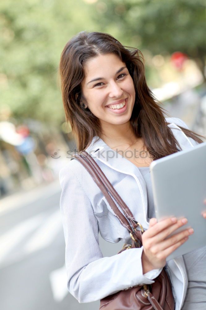Similar – Image, Stock Photo Smiling African woman using digital tablet outdoors