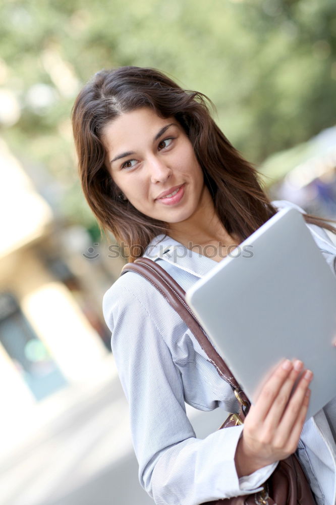 Similar – Image, Stock Photo Smiling African woman using digital tablet outdoors