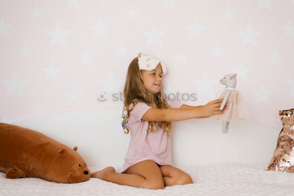 Similar – cute happy child girl relaxing at home on the bed