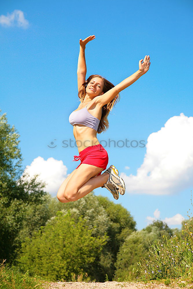 Similar – Young Woman working out outdoors and having fun