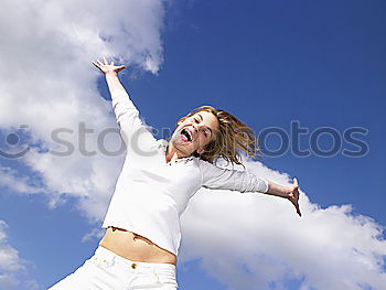 Similar – Image, Stock Photo A woman with a red cap stands in front of a wind turbine. Climate change. Alternative power generation. Renewable energy