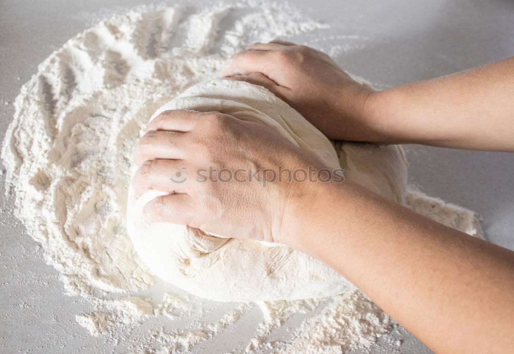 Similar – woman kneading bread dough with her hands