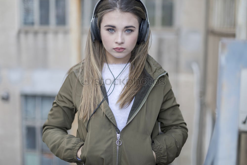 Image, Stock Photo Young girl with headphones standing on the street