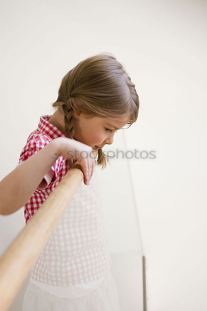 Similar – Image, Stock Photo Girl looks at dress against light from window