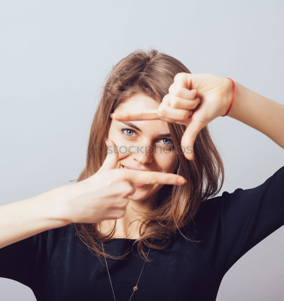 Similar – woman covering her eyes with pieces of sushi