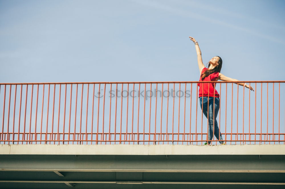 Similar – Young fitness woman runner running on city bridge.