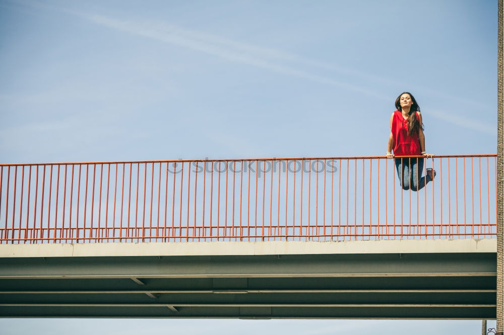 Similar – Young fitness woman runner running on city bridge.