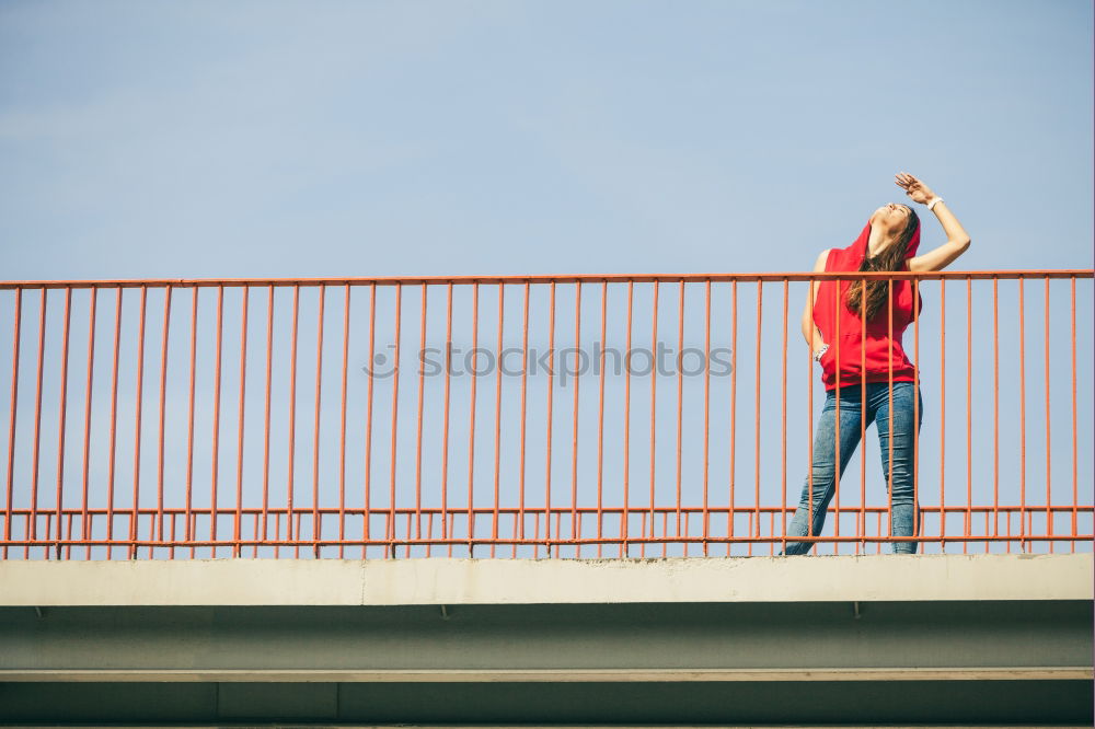 Similar – Young fitness woman runner running on city bridge.