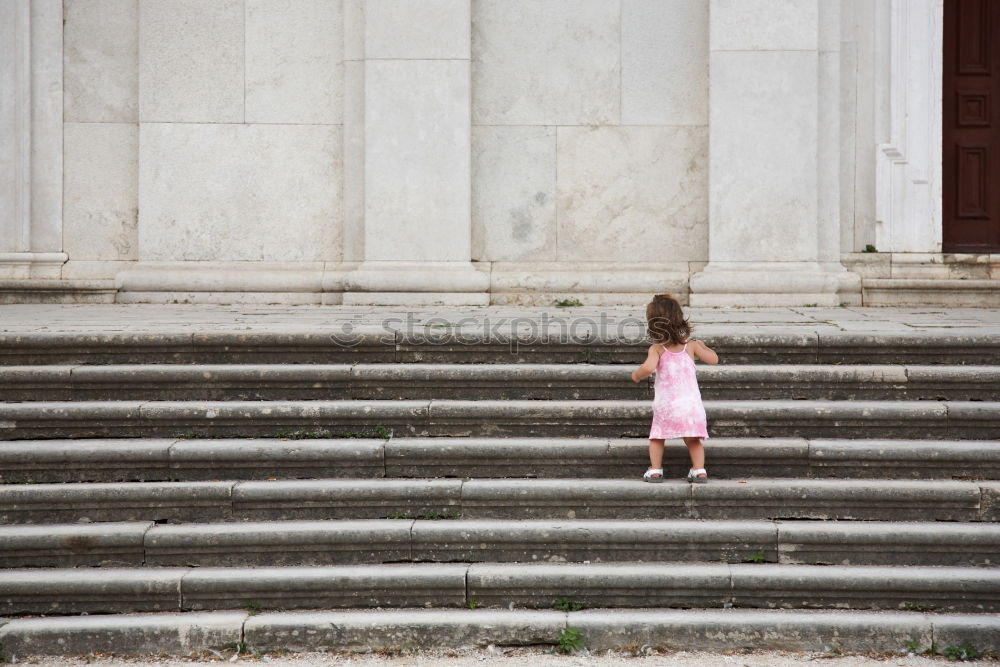 Similar – Image, Stock Photo elegantly dressed lady with black coat, red hat, red scarf and red pumps walks on a large square with concrete and patterned floor