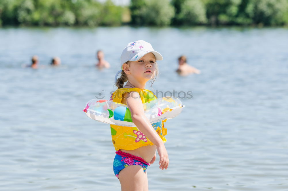 Similar – Playful girl standing in pier near lake