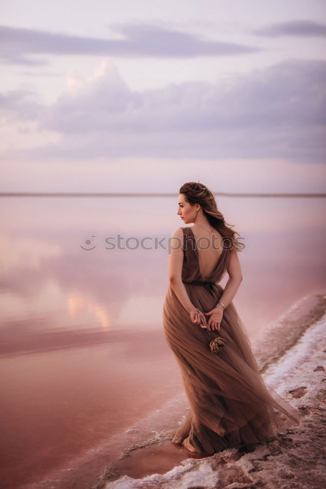 Similar – Beautiful photographer girl wearing black clothes sitting on stone floor in countryside with her camera