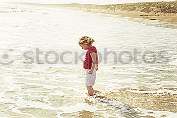 Similar – Image, Stock Photo Happy little boy playing on the beach at the day time