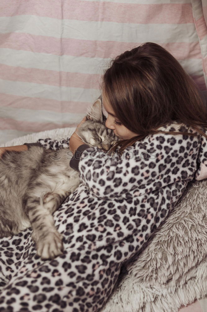 Similar – Young man sleeping with his dog