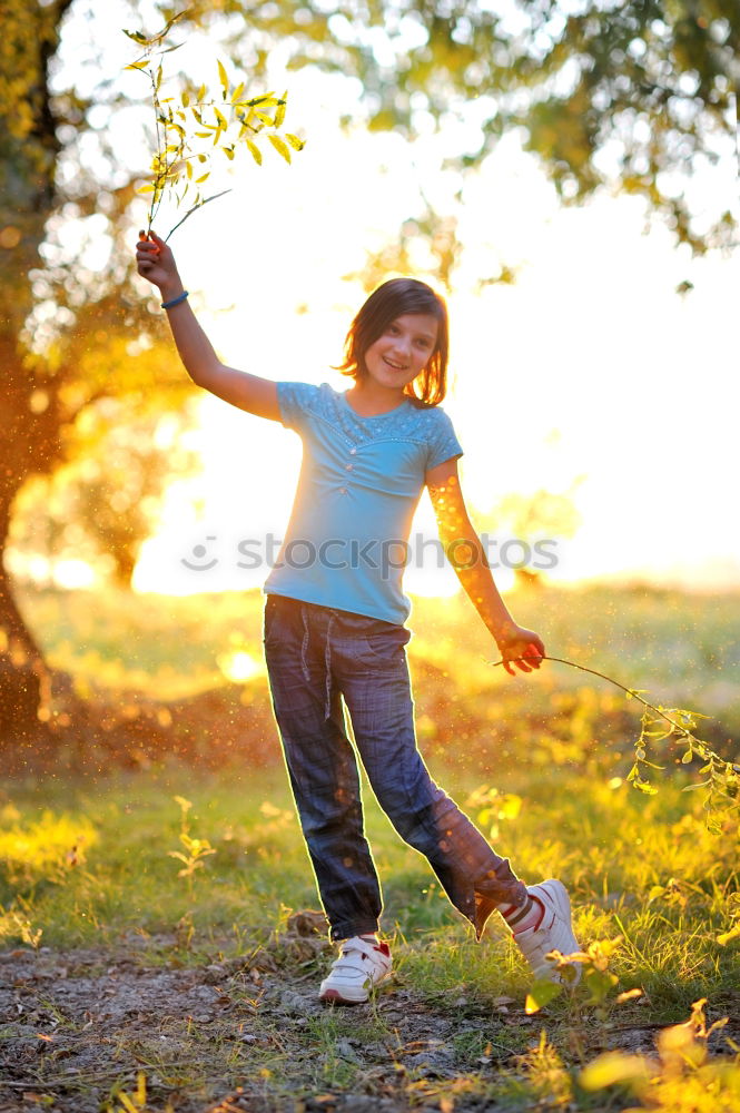 Similar – Image, Stock Photo Young girl with brown hair is playing outside.