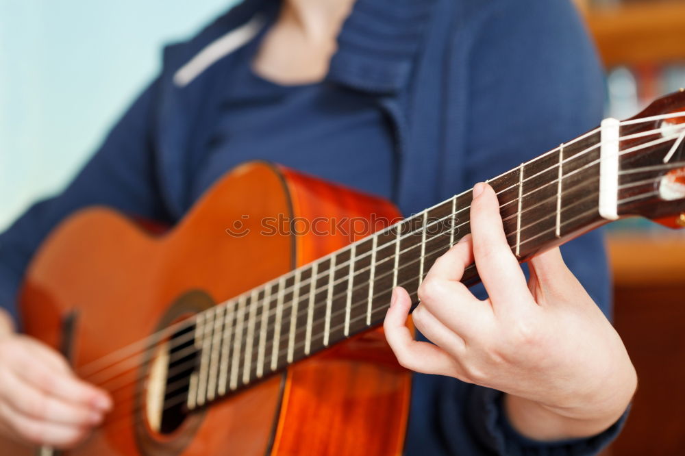 Similar – Beautiful woman playing guitar.