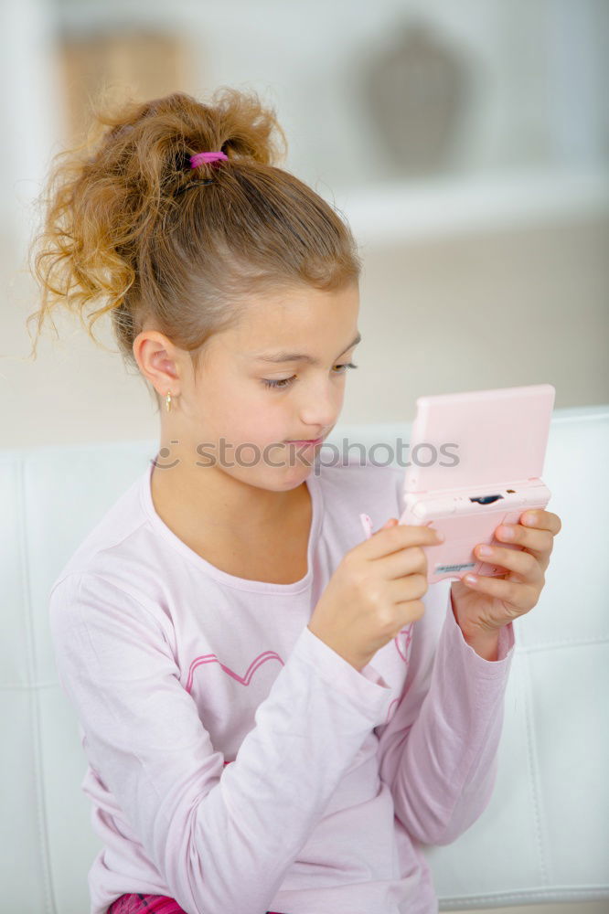 Similar – Image, Stock Photo portrait of a beautiful kid using mobile phone