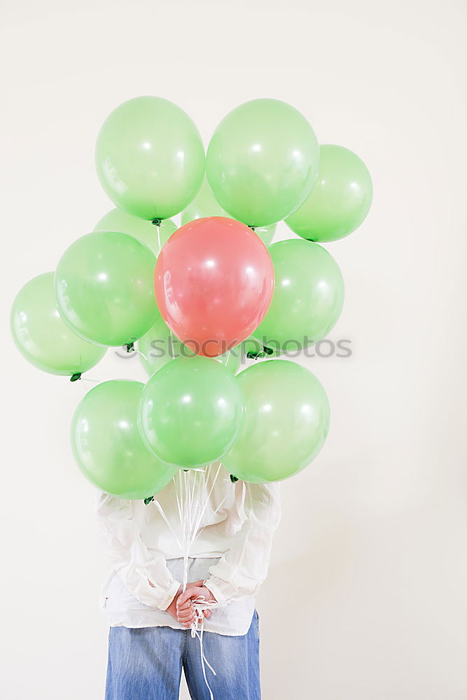 Similar – Hand holding ballooons