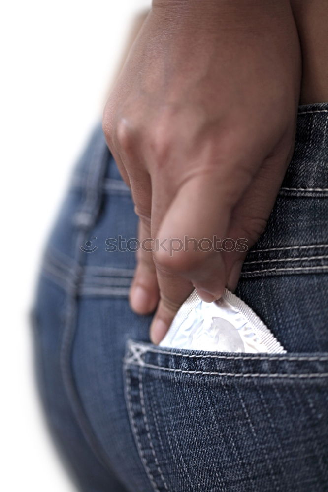 Similar – Image, Stock Photo the hand of a man who takes a condom in the pocket of his jeans